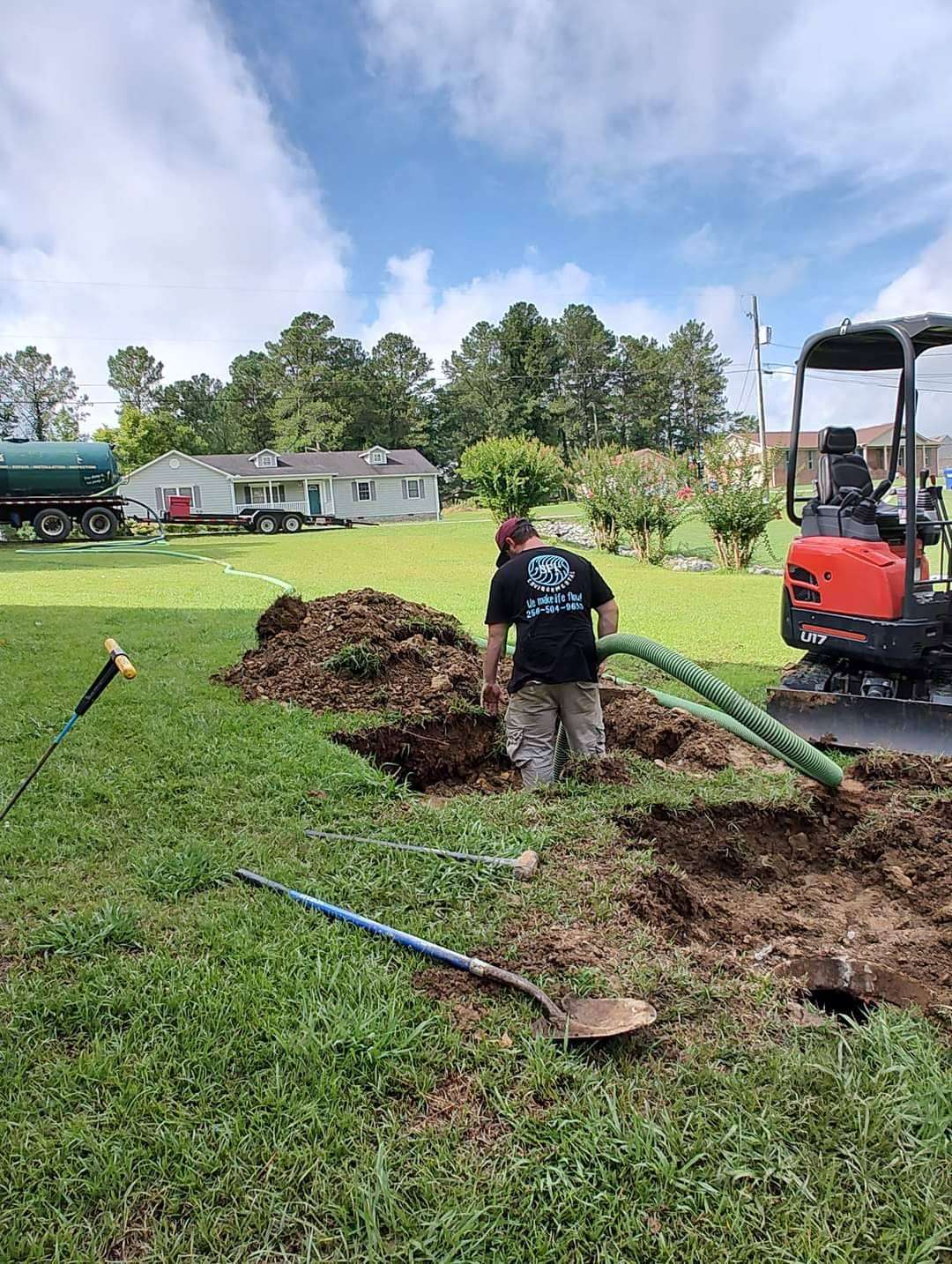 An SFI Environmental crew excavating and installing a residential septic system